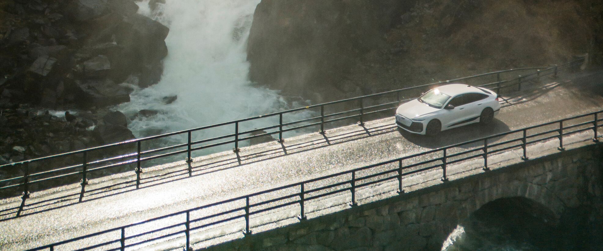 audi model driving through a bridge