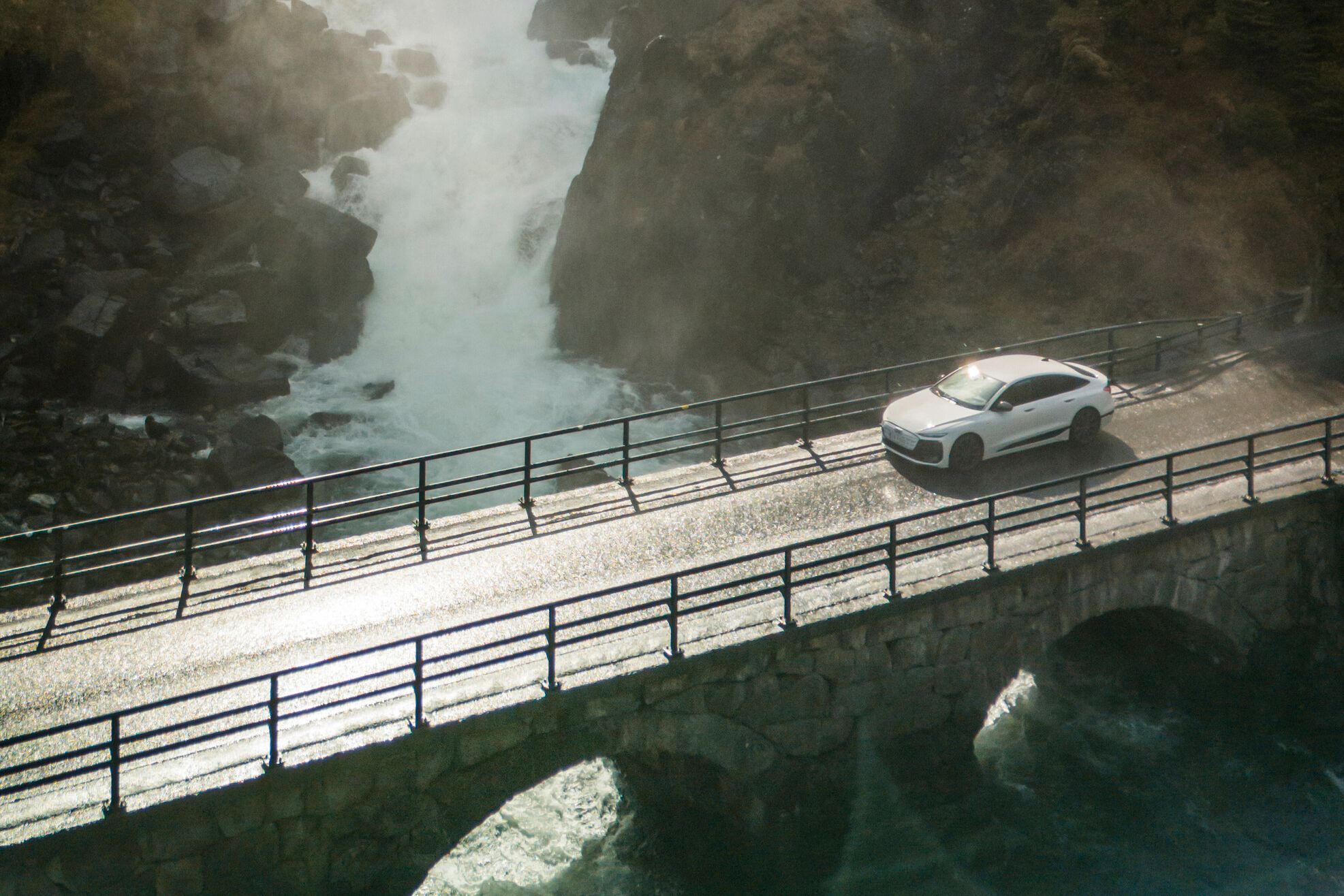 audi model driving through a bridge