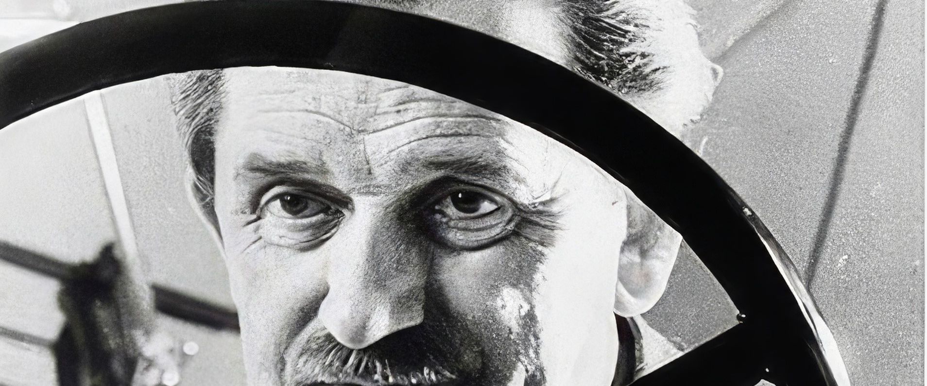 Ferdinand Porsche behind a steering wheel