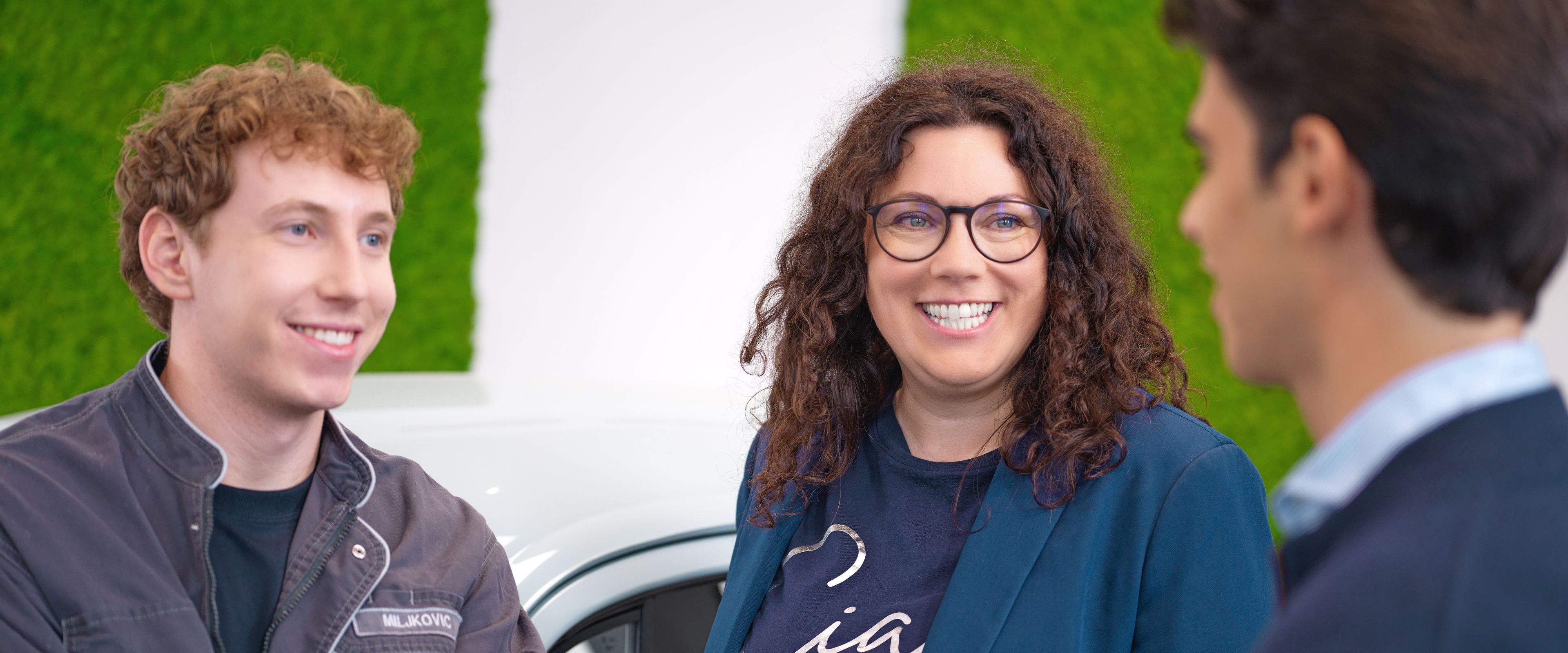 Three people are talking.