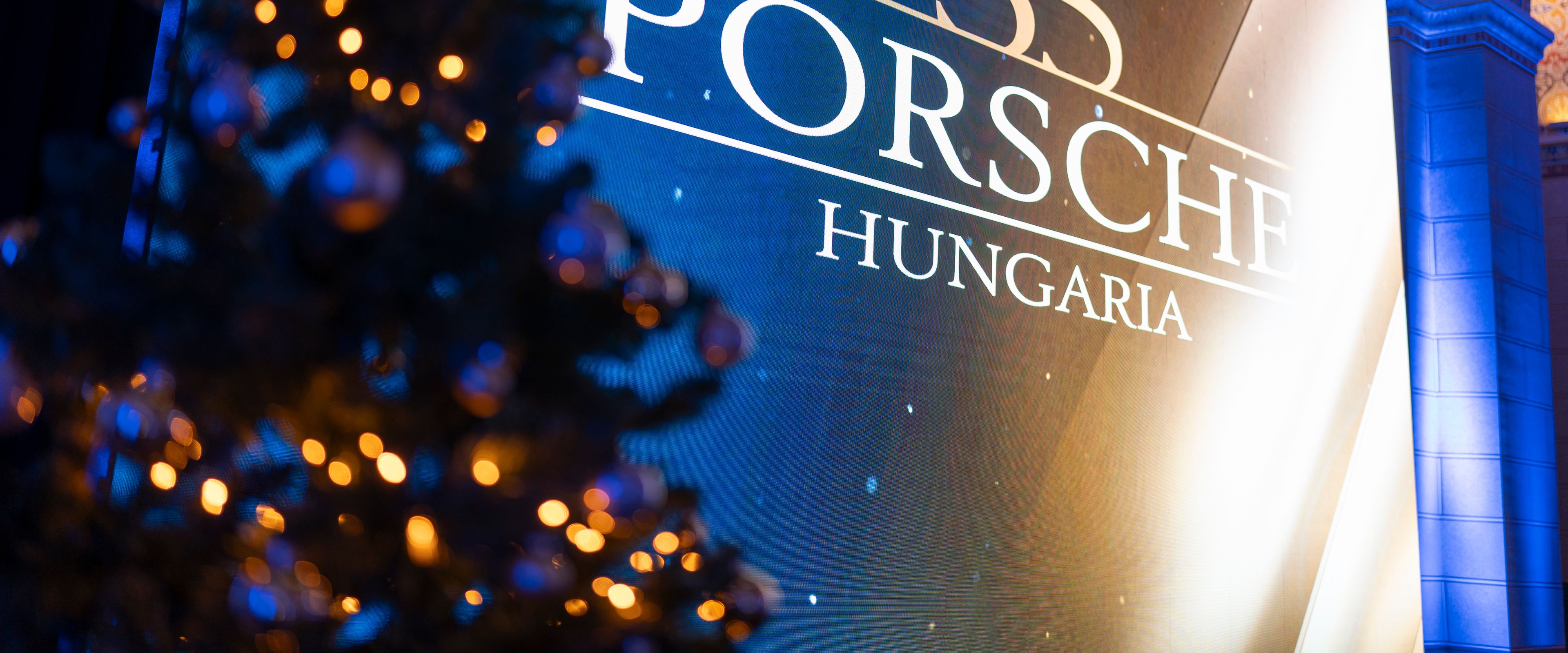Porsche Hungaria 35 inscription, next to it is a Christmas tree.
