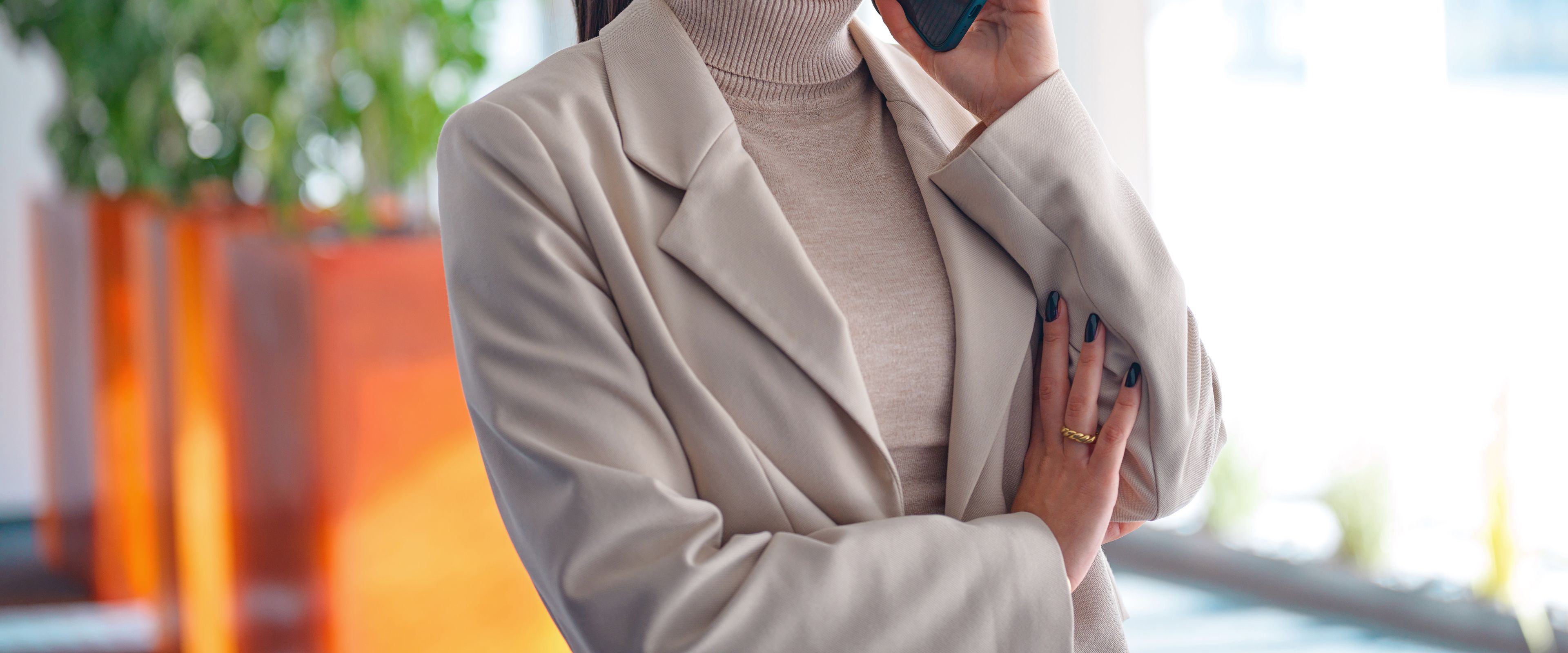 Young woman on the phone in an office environment.