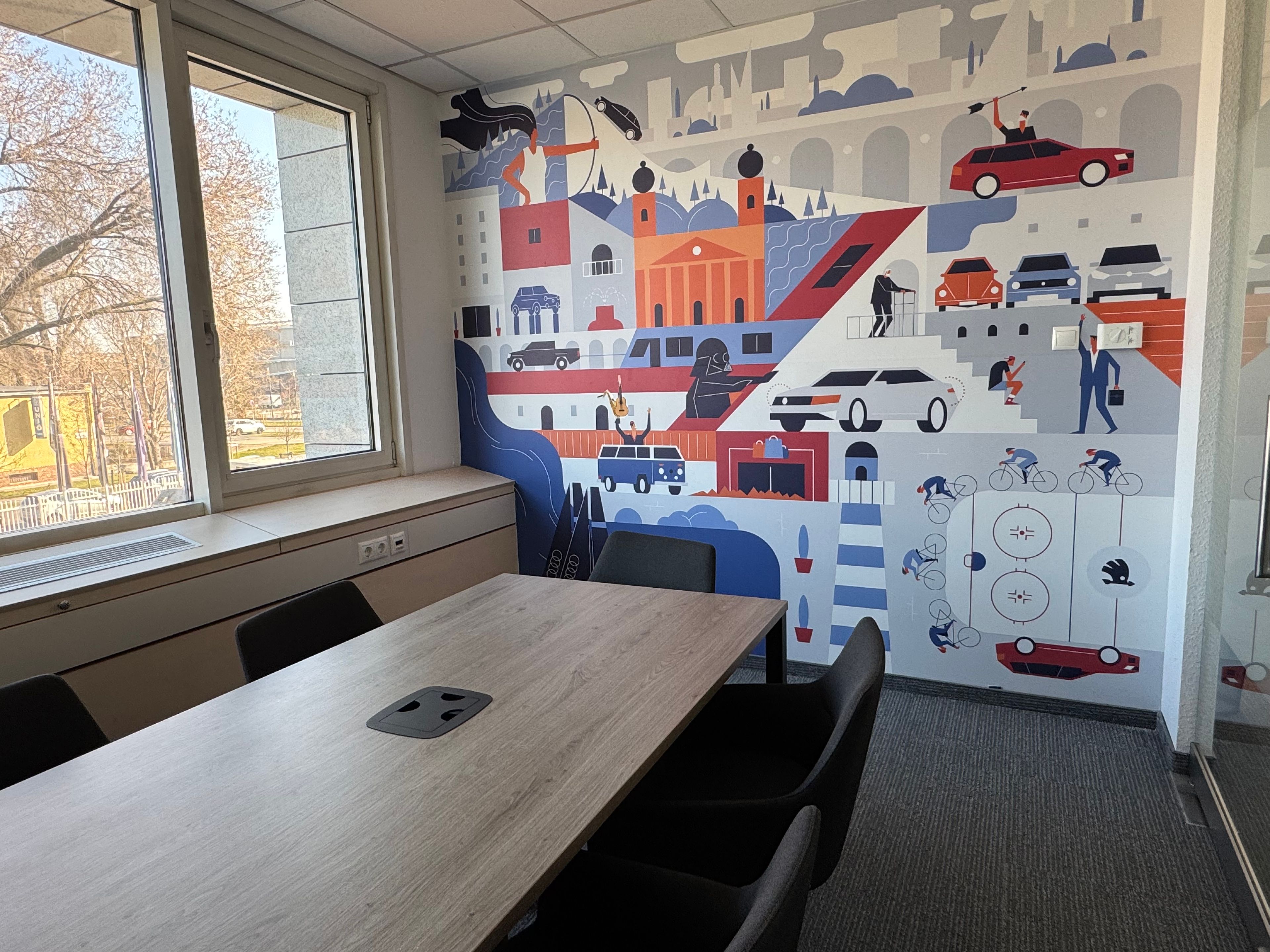 A bright office with car patterned wall painting