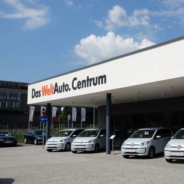 Daw welt auto centrum with VW modelles in front of the building